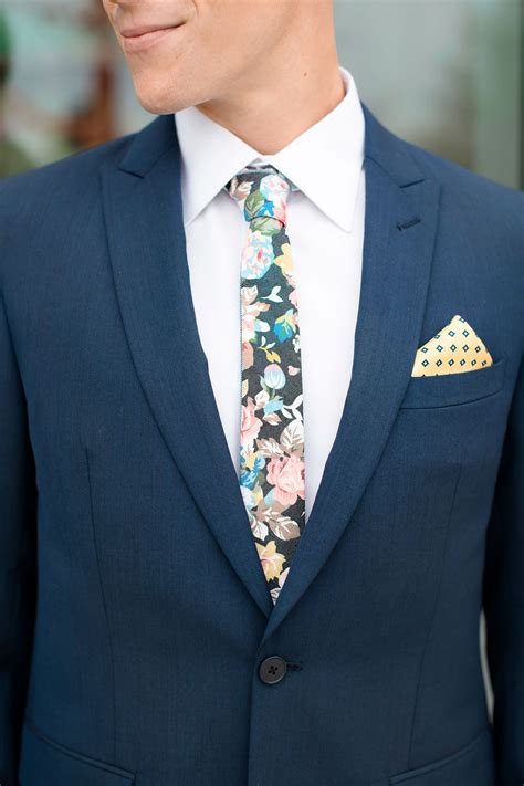 navy suit with floral tie